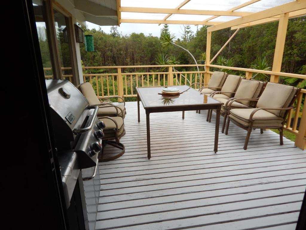 Deck with dining set and BBQ
